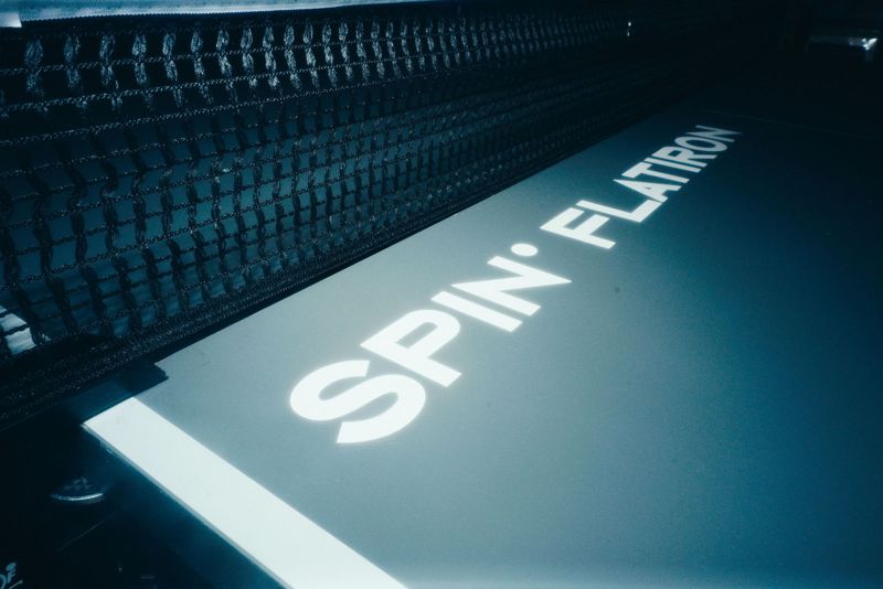 Spin Flatiron lettering on the edge of a table
