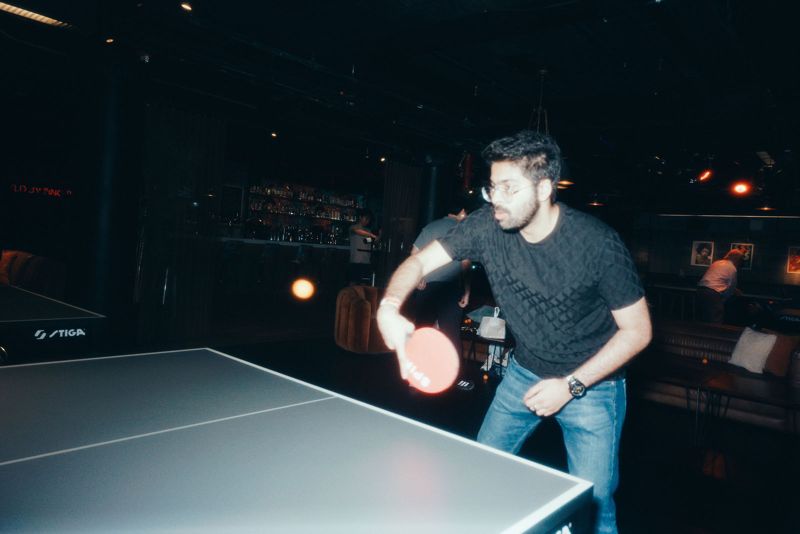 Player swinging a paddle