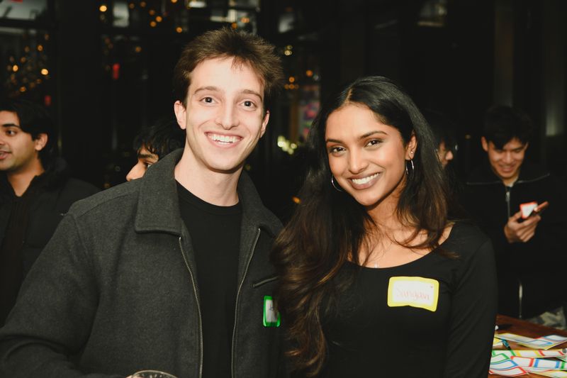 Two guests smiling together